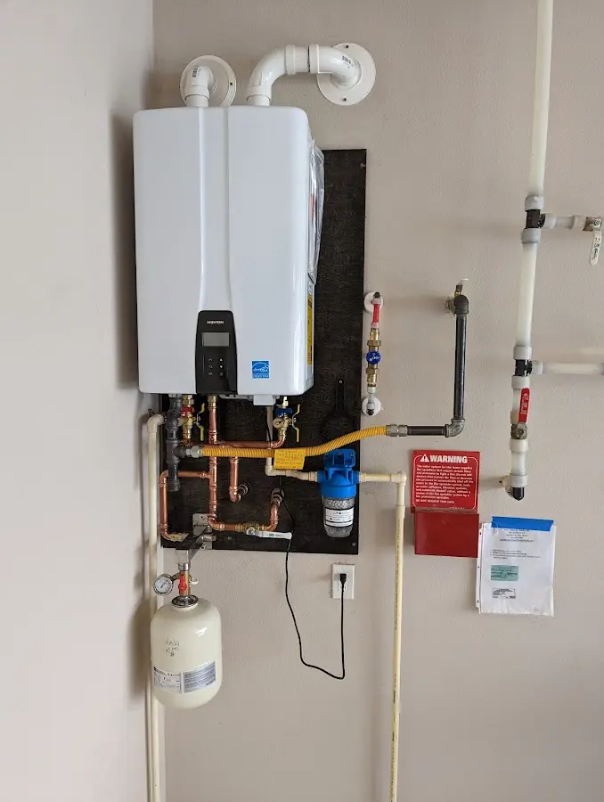 Professional plumber installing copper piping in a West Covina home